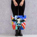 Image of a woman holding a Tote bag with artwork of a colorful cow in a Retro pop art style. Tote bags for purchase online at Woodstock Vibe.